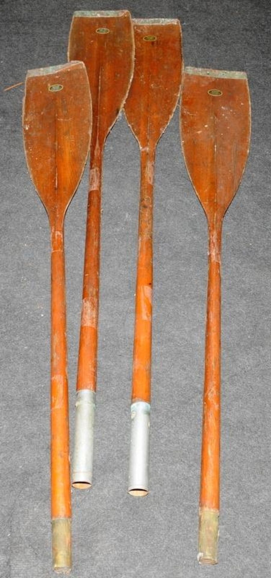 Pair of vintage two part twin bladed racing oars with copper edges by Collar Paddles