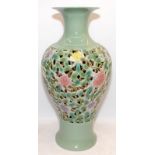 Large Oriental style baluster vase with pierced flower decoration. 58cms tall