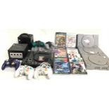 Box of various vintage gaming systems, games, controllers and leads to include Sony PlayStation 1,