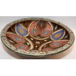 A large colourful Moorish pottery bowl. 49cms across