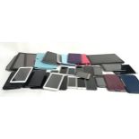 Tray containing a collection of various smartphones and tablets to include Apple, Motorola and