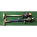 Dyson v7 animal cordless vacuum cleaner together with Dyson v8 cordless vacuum cleaner, both with