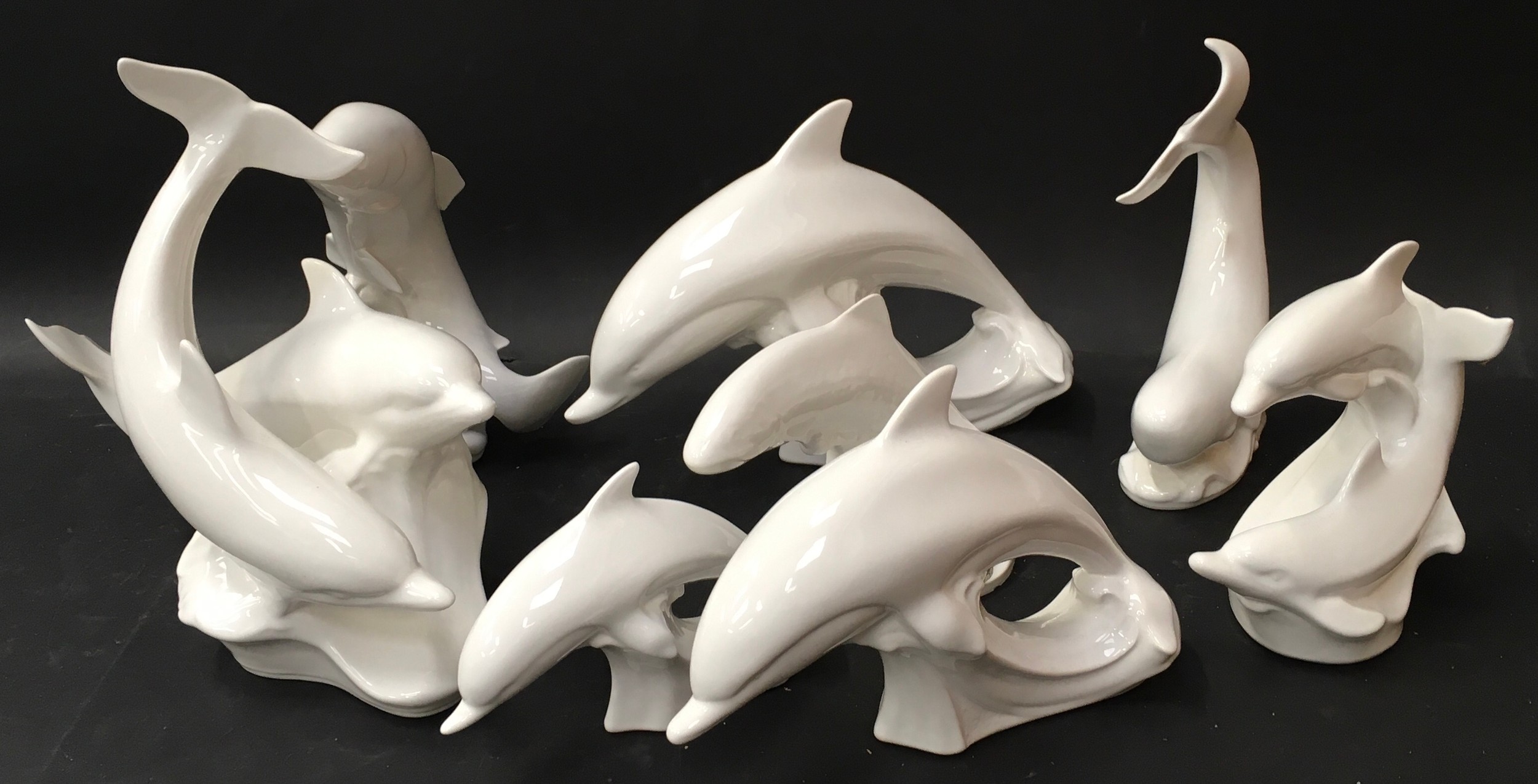 Poole Pottery collection of white figures to include, Dolphins, Whale, Salmon & Trout (8)