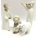 Collection of Lladro figures to include an Eskimo child with a polar bear cub, a polar bear and