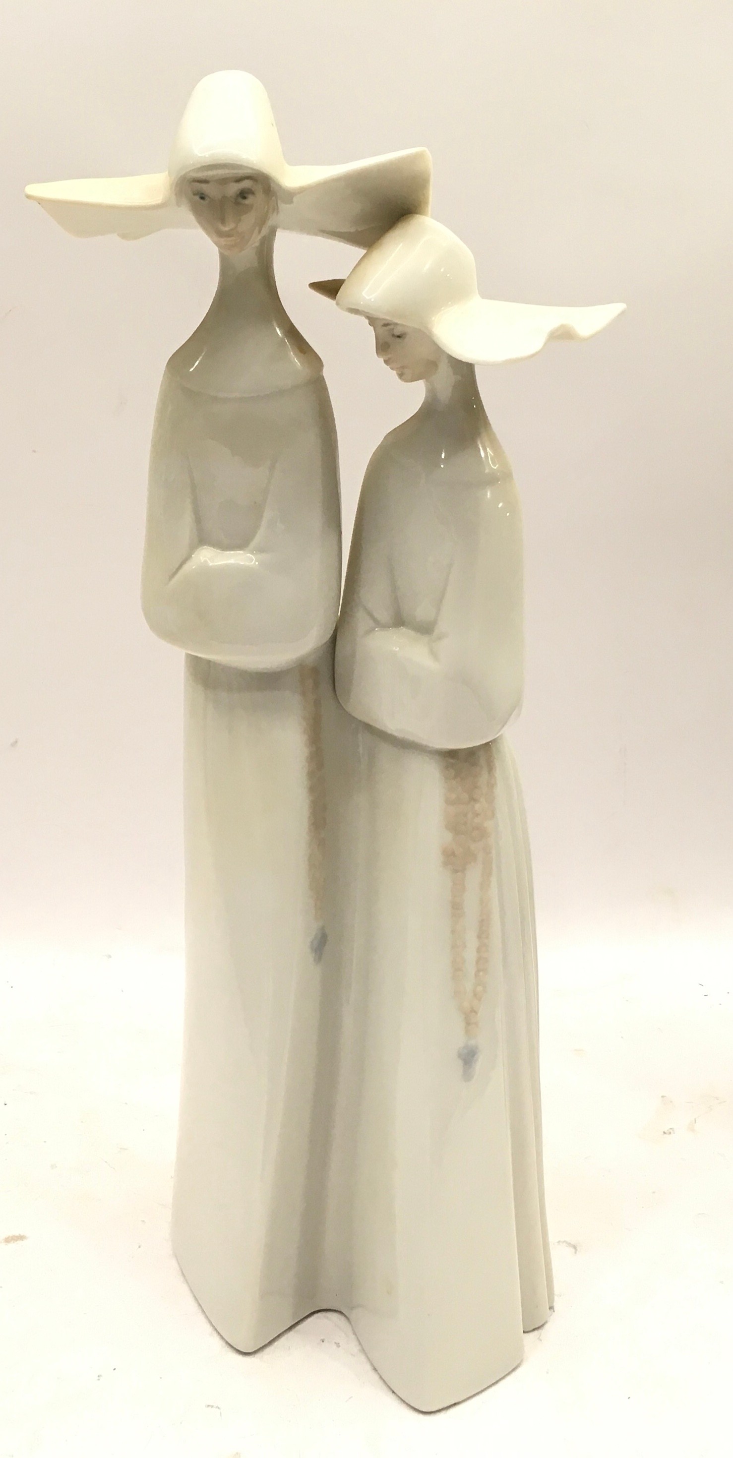 Two large Lladro figures, a gloss finish study of two nuns and a matt finish study of a hooded monk. - Image 2 of 5