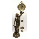 Bronzed mantle clock featuring a semi nude lady in an Art Deco style. Seen working. O/all height