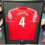 Signed and framed Sami Hyypia Liverpool FC match shirt. O/all frame size 109cms x 87cms