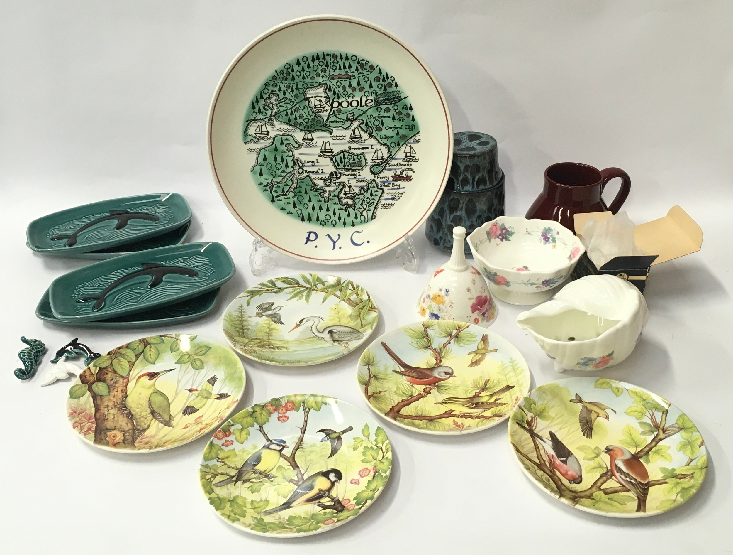 Poole Pottery quantity to include map plate Seacreast lidded pot, bone china pieces, brooches,