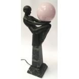 Antique Enigme Bronze Art Deco style woman on top of a marble Obelisk Lamp holding a glass globe