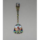 An Egyptian Revival silver and gilt and enamel spoon with Moses basket and baby