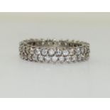 A 925 silver and CZ double row band ring , Size R