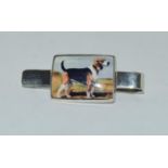 A Silver and enamel document clip with pictorial image of a dog.