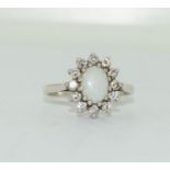 A 925 silver and opal cluster ring, Size K