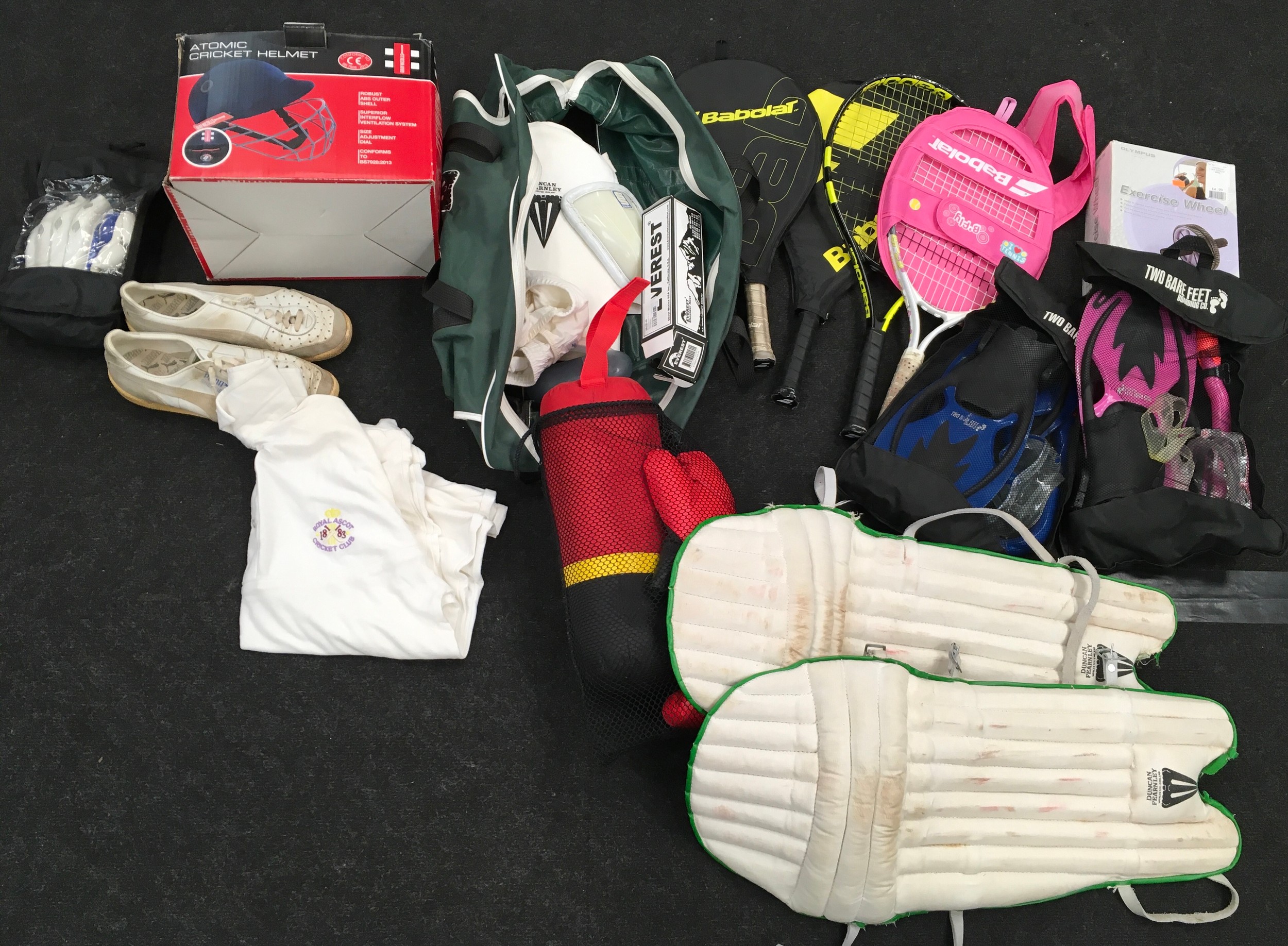 Large collection of various sports equipment and accessories to include mainly cricket items