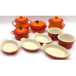 A quantity of Le Creuset ceramics to include lidded pots, ramekins and individual serving dishes. 10