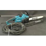 Makita UC4041A electric chainsaw in good working order.