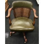 Vintage leather seat office chair with wicker back support on brass castors 8065x45cm