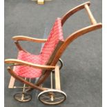 Vintage wood with fabric seat child's push chair. Ideal for displaying a large doll. Height to