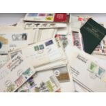Large number of first day covers and mint stamp sets. Mostly GB but also includes a number of FDC'