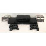 Three Sony PlayStation 3 consoles together with four controllers and 15 games.