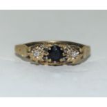 9ct gold ladies 3 stone sapphire and diamond ring size O