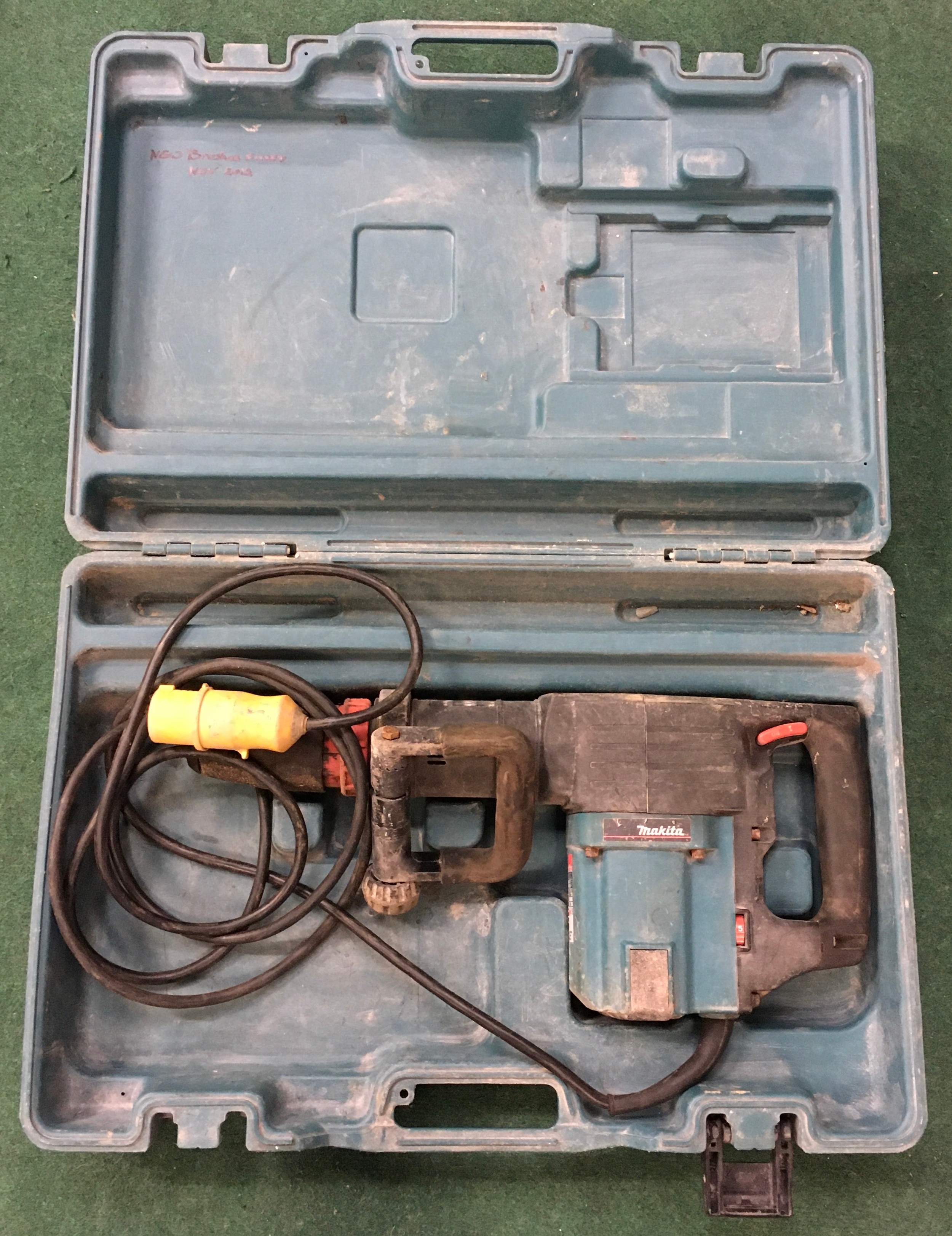 Makita HM1202C demolition hammer in hard carry case.