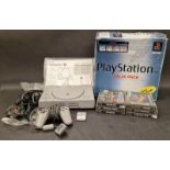 Sony PlayStation boxed console to include leads and controller and six games.