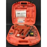 Paslode Impulse IM 350/90 CT nail gun in hard plastic case.