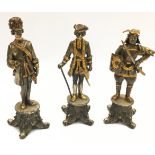 Three quality cast metal figures with gilded accents, including a Samurai warrior and two 18th