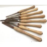 A collection of eight wood turning tools.