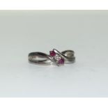 9ct gold ladies diamond and ruby twist ring size L