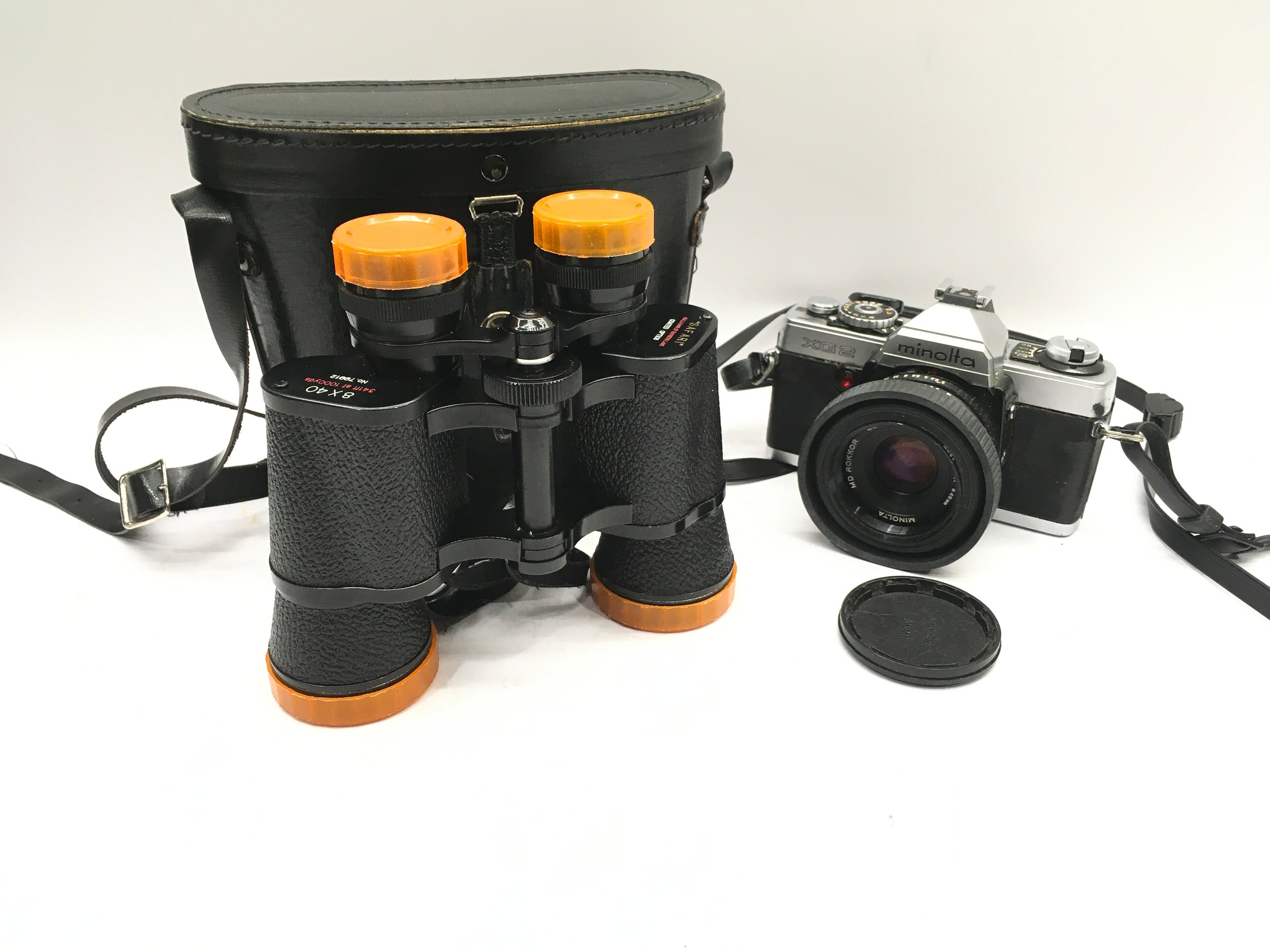 Minolta XG2 35mm SLR camera with fitted Rokkor 45mm lens c/w a pair of Sullivans Safari binoculars