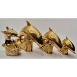 Set of three graduated gold painted Dolphins together with similar double Dolphin marked Poole