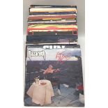 44 ROCK RELATED VINYL SINGLE RECORDS. A nice selection including - Guns N’ Roses - Thin Lizzy -