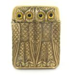 A brass cased vesta in the form of owls.