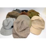 A quantity of cloth caps and baseball hats, many still with tags. Ten items in lot