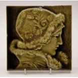J & W Wade relief moulded tile possibly designed by Isaac Broome depicting a female head,