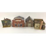 Three boxes of On30 scale well built Wild West buildings and accessories together with O Scale