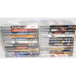 A collection of PSP UMD Video cartridges in original boxes. 22 in lot