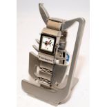 Fishbone branded stainless steel 'reverso' watch/bracelet and stand
