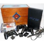 PS2 console with controllers, mains cable and five games c/w a wooden document box