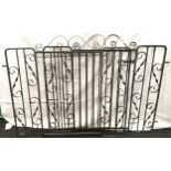 Large pair wrought iron gates with slatted middle and scroll work sides. Brackets included.