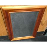 Modern pine wall mirror with bevelled edged glass 61x87cm.