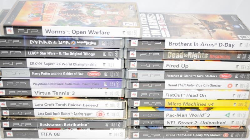 A collection of PSP games cartridges in original boxes. 21 in lot