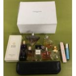 Mixed perfumes in a Christian Dior box (WP).