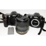 2 x Nikon D90 DSLR camera bodies c/w 1 x AF-S Nikkor 18-105mm zoom lens and battery. No battery