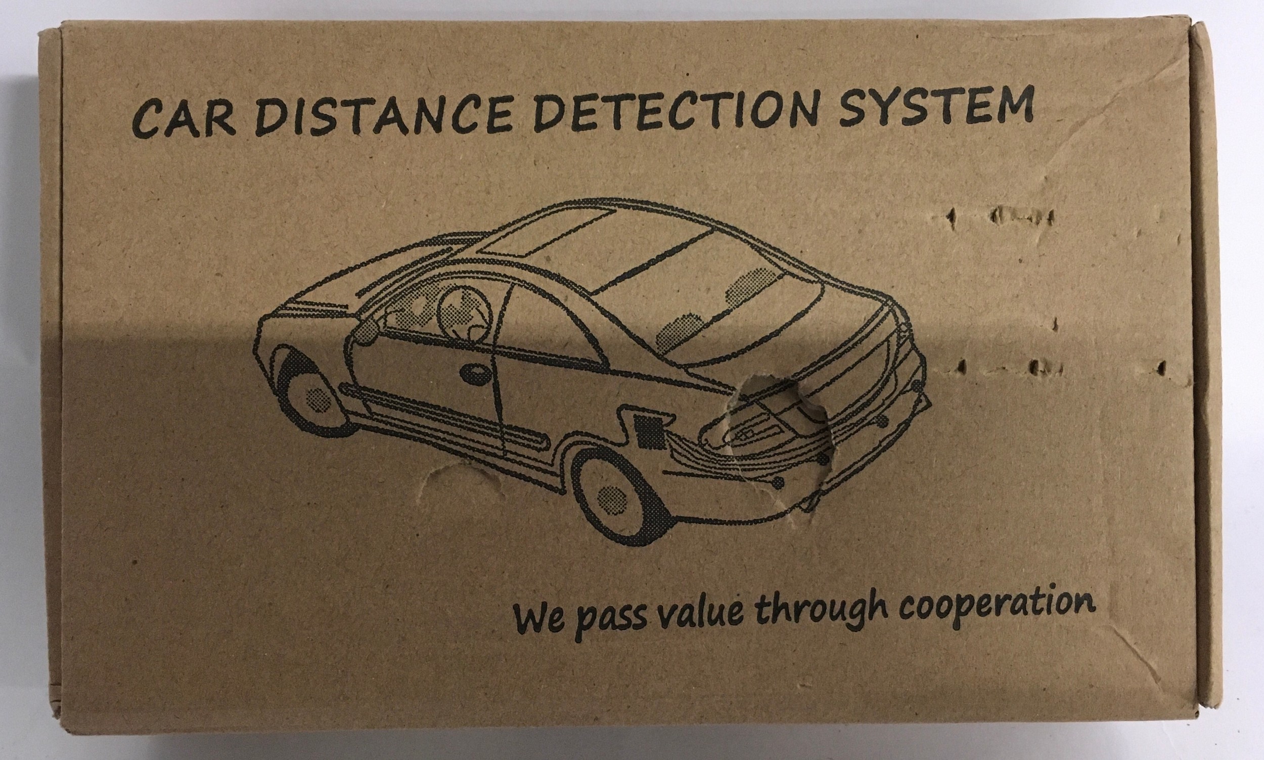 A Car distance detection system, unopened box. (70)