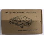 A Car distance detection system, unopened box. (70)