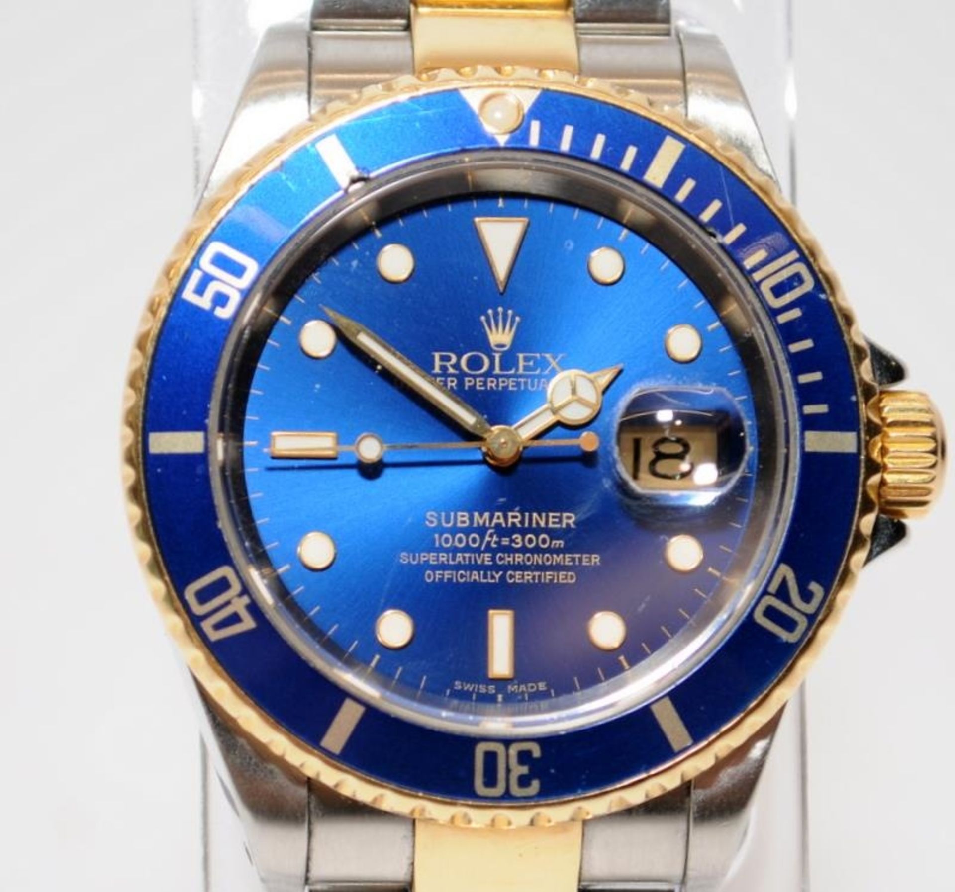 Gents Rolex Oyster Perpetual Date Submariner automatic chronometer, model number 16613. Blue dial