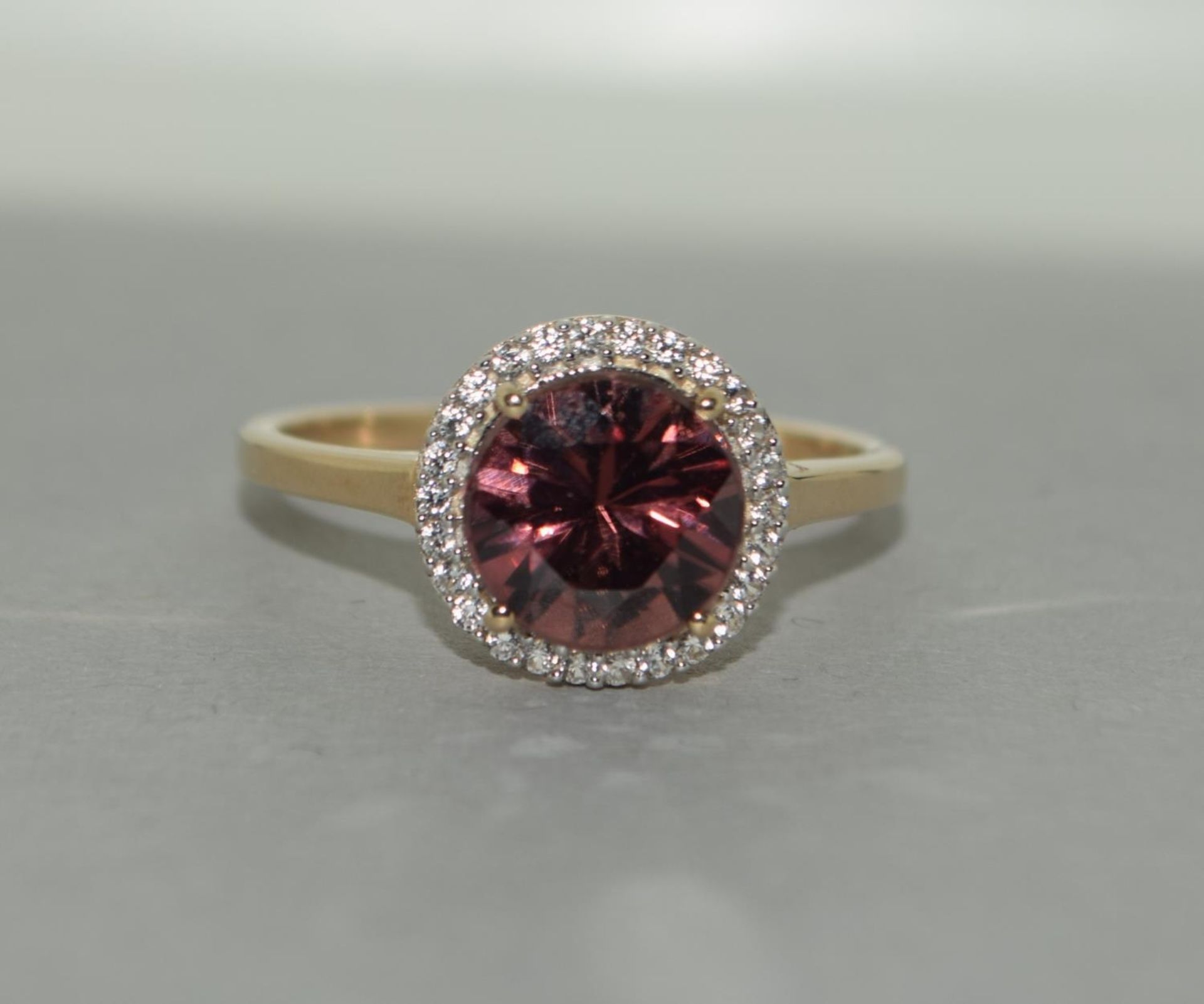 A 9ct gold natural pink zircon ring Size N 1/2.
